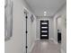 Hallway featuring light gray walls, recessed lighting, and modern doors, with dark hardware at 1515 Jonesboro Rd, Atlanta, GA 30315