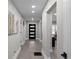 Hallway with modern lighting and hardware leading to the living room at 1515 Jonesboro Rd, Atlanta, GA 30315