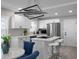 Bright kitchen featuring modern appliances, white cabinets, and a stylish geometric light fixture at 1515 Jonesboro Rd, Atlanta, GA 30315