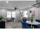 Open living and dining area featuring modern furnishings and large windows, for ample natural light at 1515 Jonesboro Rd, Atlanta, GA 30315