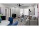 Comfortable living room with neutral décor, area rug, modern furniture, and updated lighting at 1515 Jonesboro Rd, Atlanta, GA 30315