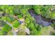 Birds eye view of property with lake access and mature trees at 226 Sandra Nw Dr, Lilburn, GA 30047