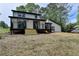 Back of the house with deck and a spacious backyard at 226 Sandra Nw Dr, Lilburn, GA 30047
