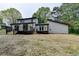 Exterior of home featuring a spacious backyard with dual decks at 226 Sandra Nw Dr, Lilburn, GA 30047