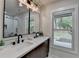 Bathroom with double sink vanity, quartz counters, and new fixtures at 226 Sandra Nw Dr, Lilburn, GA 30047