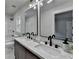 Updated bathroom with double sinks and large mirrors at 226 Sandra Nw Dr, Lilburn, GA 30047