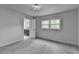 This bedroom has neutral walls, carpet and a window at 226 Sandra Nw Dr, Lilburn, GA 30047