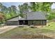 Charming home featuring a two-car garage and complemented by landscaping, offering both convenience and curb appeal at 226 Sandra Nw Dr, Lilburn, GA 30047