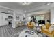 Spacious living area with open concept design featuring a modern kitchen and comfortable seating at 226 Sandra Nw Dr, Lilburn, GA 30047