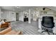 Open-concept living space with modern flooring, seamless transitions to the kitchen, and bright, inviting ambiance at 226 Sandra Nw Dr, Lilburn, GA 30047