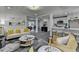 Open-concept living room boasting neutral décor, modern lighting, and seamless flow into the kitchen at 226 Sandra Nw Dr, Lilburn, GA 30047