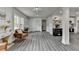 Bright living room with modern flooring, stylish furniture, and direct access to the kitchen, perfect for entertaining at 226 Sandra Nw Dr, Lilburn, GA 30047