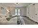 This main bedroom has wood floors and a door to a balcony with a view of the trees at 226 Sandra Nw Dr, Lilburn, GA 30047