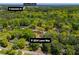 Aerial view of home and surrounding wooded neighborhood near Atlanta Skyline and Interstate 20 at 3224 Laura Way, Winston, GA 30187
