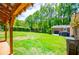Lovely backyard with a covered porch and carport, perfect for outdoor entertaining and relaxation at 3224 Laura Way, Winston, GA 30187