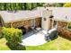 Backyard patio with brick exterior, outdoor furniture, and well-maintained green space at 3224 Laura Way, Winston, GA 30187