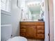 Bright bathroom with white counter tops, oak cabinets, and tiled floors at 3224 Laura Way, Winston, GA 30187
