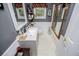 Well-lit bathroom featuring a white vanity with a faux stone countertop and gold-framed shower at 3224 Laura Way, Winston, GA 30187