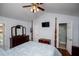 Bedroom featuring hardwood floors, ensuite bath, and ceiling fan at 3224 Laura Way, Winston, GA 30187