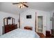 Bright bedroom with four poster bed, ceiling fan, and ensuite bathroom access at 3224 Laura Way, Winston, GA 30187