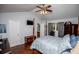 Bedroom features hardwood floors, natural light, and an ensuite bathroom at 3224 Laura Way, Winston, GA 30187