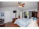 Vaulted ceiling bedroom with ensuite access, ceiling fan, and hardwood floors at 3224 Laura Way, Winston, GA 30187