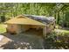 Attached carport with covered parking and a brick exterior offering convenient access to the home at 3224 Laura Way, Winston, GA 30187