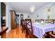 Spacious dining area featuring a long table with seating for eight and a vintage china cabinet at 3224 Laura Way, Winston, GA 30187