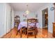 Cozy dining room showing table with seating for six and hardwood floors in a well-lit space at 3224 Laura Way, Winston, GA 30187