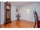 Inviting foyer with hardwood floors, and a grandfather clock adding timeless charm to the home's entrance at 3224 Laura Way, Winston, GA 30187