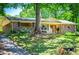 Ranch-style home with brick exterior, covered porch, and well-maintained lawn with mature trees at 3224 Laura Way, Winston, GA 30187
