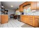 Eat-in kitchen featuring updated appliances, plenty of counter space, and classic tile flooring at 3224 Laura Way, Winston, GA 30187