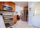 Modern kitchen features stainless steel appliances, oak cabinets, and a stylish tile backsplash at 3224 Laura Way, Winston, GA 30187