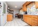 Kitchen with wooden cabinets, stainless steel dishwasher, a kitchen nook and tile floors at 3224 Laura Way, Winston, GA 30187