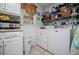Organized laundry room with shelving, cabinets, and washer and dryer at 3224 Laura Way, Winston, GA 30187