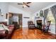 Inviting living room with hardwood floors, fireplace, and comfortable leather seating under a vaulted ceiling at 3224 Laura Way, Winston, GA 30187