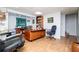Spacious home office with wood flooring, large desk, built-in shelving, and neutral wall paint at 3224 Laura Way, Winston, GA 30187
