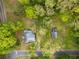 Aerial view of a charming house surrounded by lush greenery and trees, offering privacy and a serene setting at 3460 Old Fairburn Rd, South Fulton, GA 30349