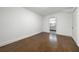 Bedroom with hardwood floors leading to bathroom with double sinks at 3460 Old Fairburn Rd, South Fulton, GA 30349