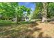 Charming home with a well-maintained lawn surrounded by mature trees at 3460 Old Fairburn Rd, South Fulton, GA 30349