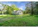 Charming exterior of a well-maintained home with a spacious lawn and mature trees at 3460 Old Fairburn Rd, South Fulton, GA 30349