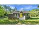 Charming single-Gathering home with a well-maintained lawn and a bright yellow front door at 3460 Old Fairburn Rd, South Fulton, GA 30349