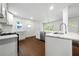 Modern kitchen with stainless steel appliances, granite countertops, and white cabinetry at 3460 Old Fairburn Rd, South Fulton, GA 30349