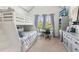 Bedroom with a bunk bed, a blue-and-white striped curtain, a TV, and a built-in desk at 6414 Blue Water Dr, Buford, GA 30518