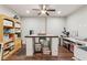 Versatile craft room featuring a large workspace, storage, and natural light, perfect for hobbies at 6414 Blue Water Dr, Buford, GA 30518
