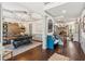 Open dining area with coffered ceiling, views of the living room and a staircase, with elegant decor at 6414 Blue Water Dr, Buford, GA 30518