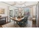 Elegant dining room showcasing a large table, ample natural light, and decorative accents at 6414 Blue Water Dr, Buford, GA 30518