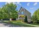 Charming two-story home with landscaped yard and a welcoming front porch and covered entrance at 6414 Blue Water Dr, Buford, GA 30518