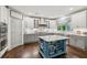 Modern kitchen featuring a blue island, stainless steel appliances, and designer finishes at 6414 Blue Water Dr, Buford, GA 30518