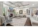 Bright living room with coffered ceiling, fireplace, and stylish furnishings at 6414 Blue Water Dr, Buford, GA 30518